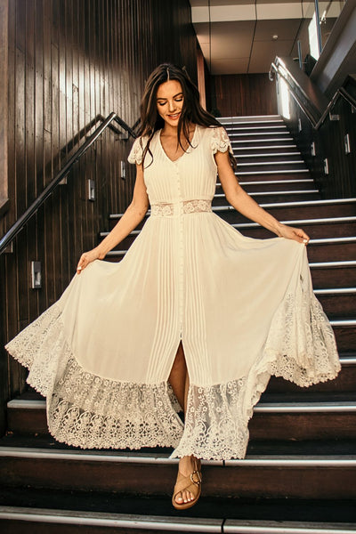 cream dress on stairs