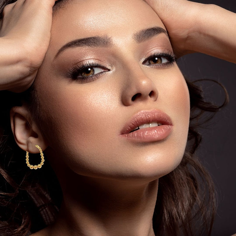 Gold Hoop Earrings on woman