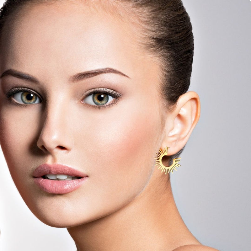 Gold Earrings on woman