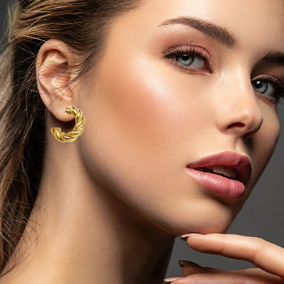 Gold Earrings on woman