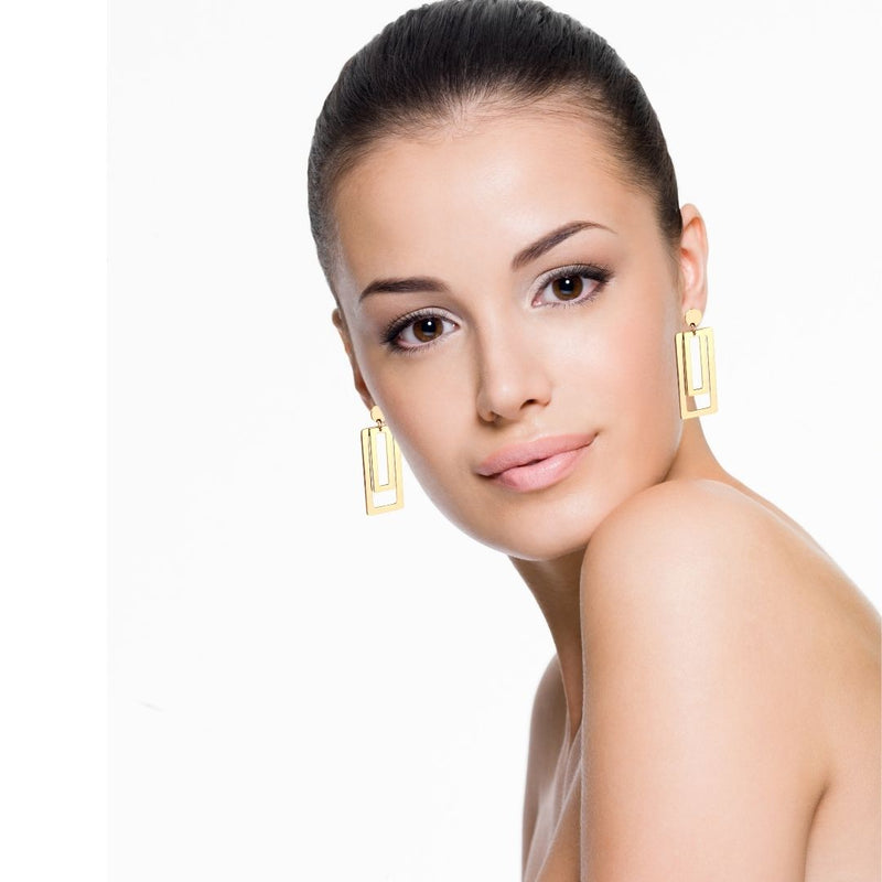 rectangle gold hoop earrings on woman