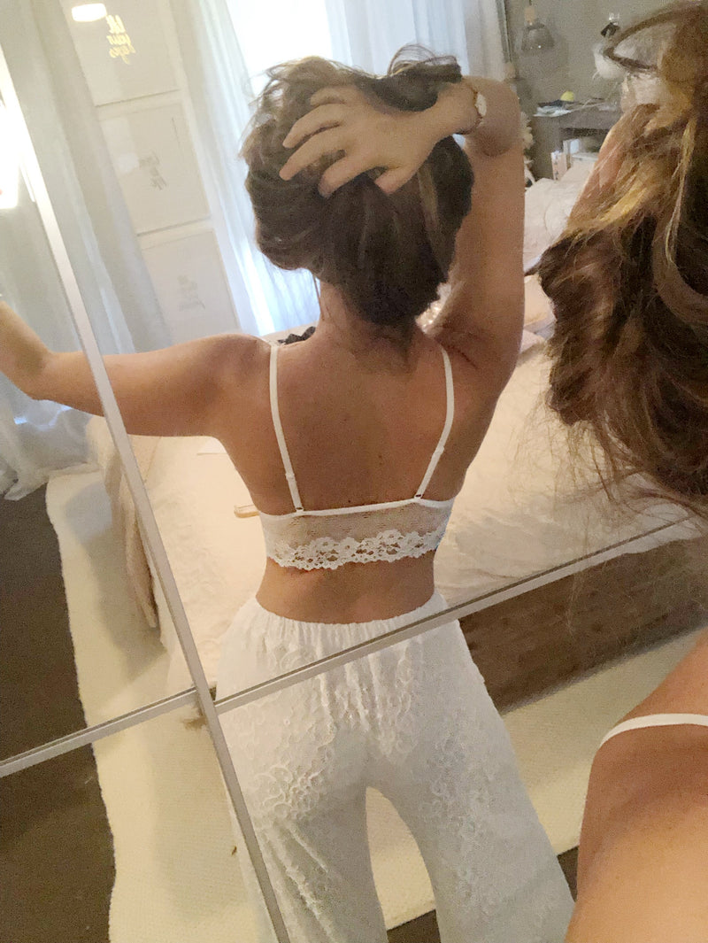 back of white lace boho bra with straps